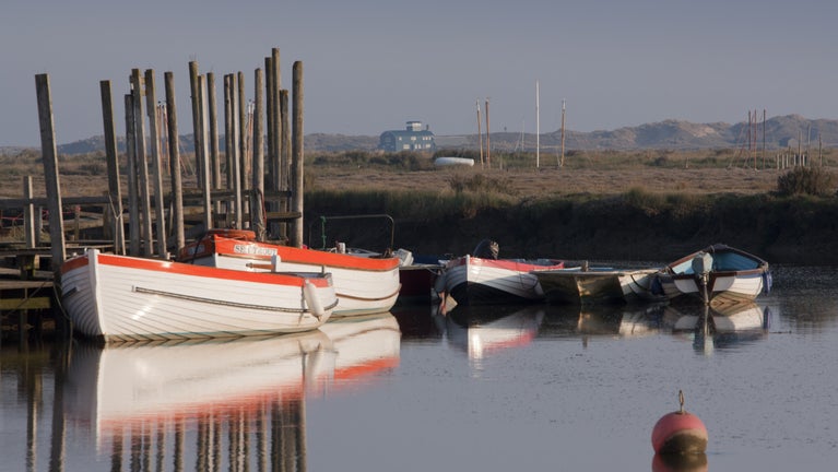 Ferry boats at high tide at Morston Quay.